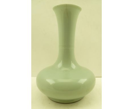 A CHINESE CELADON GLAZED PORCELAIN VASE of onion form with flared rim, Chien Lung seal mark in cobalt blue to base, 23cm high