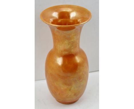 A RUSKIN CERAMIC VASE of flared rim form, decorated in an orange lustre glaze, impressed to base, "Ruskin, England, 1914", 18