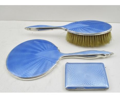 AN ART DECO SILVER AND BLUE GUILLOCHE ENAMEL CIGARETTE CASE 1929, 6cm x 6cm, together with an ART DECO HAND MIRROR AND MATCHI
