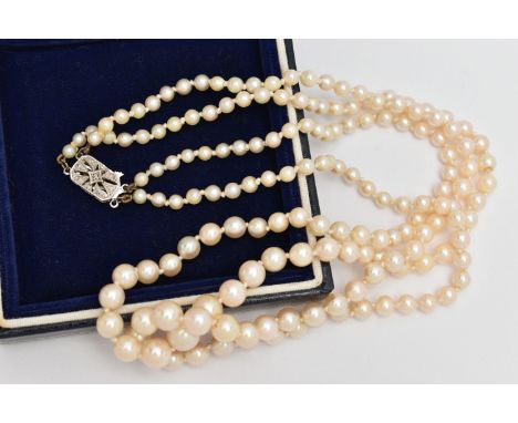 A DOUBLE ROW CULTURED PEARL NECKLACE, double strand of graduated individually knotted cultured pearls, cream pearls with a pi