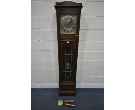 A 20TH CENTURY OAK LONGCASE CLOCK, the brass and silvered 10 inch dial with Roman numerals, two weights, one pendulum and a t