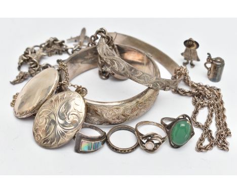 A BAG OF SILVER AND WHITE METAL JEWELLERY, to include a foliage detailed hinged bangle, hallmarked Birmingham, a smaller silv