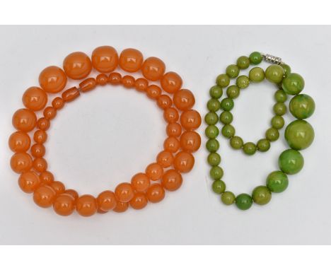 TWO EARLY TO MID 20TH CENTURY BAKELITE BEAD NECKLACES, the first a single row of circular orange beads, largest measuring app