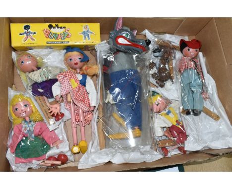 A BOX OF PELHAM PUPPETS, seven puppets comprising Cowboy, Dutch Girl, Wolf, Pinocchio, Bengo and two girl puppets, with a non