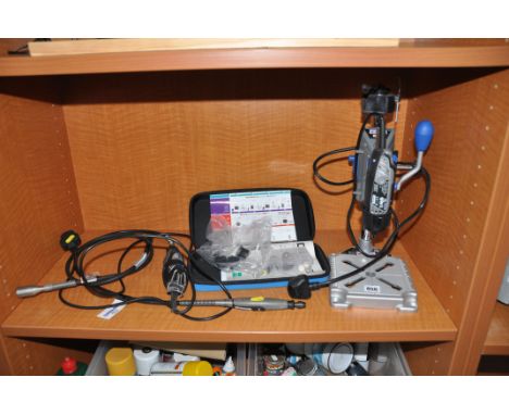 A DREMMEL MODEL 3000 ROTARY TOOLS on a Work Station 200, a Model 300 rotary tool with a flexi shaft, another Dremel Flexi Sha