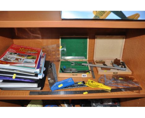 A COLLECTION OF MODELLERS MARKING AND MEASURING TOOLS including square, bevel squares, a Faithful marking set, plans, tool ca