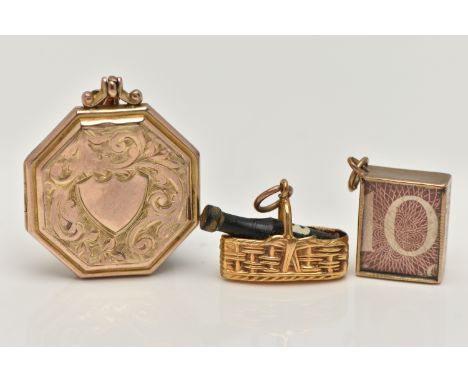 TWO 9CT GOLD CHARMS AND A LOCKET, the first charm designed as a 9ct gold basket containing a wine bottle, the second charm a 