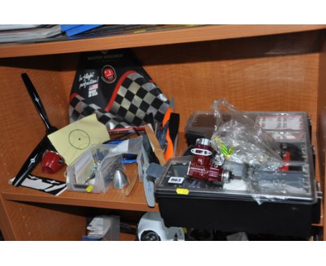 A SELECTION OF RC MODEL PLANE PARTS including an Irvine 46 engine, exhausts, propellers, a Master Airscrew propeller and nose