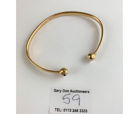 9k gold bangle, 8” circumference, w: 15.8 gms