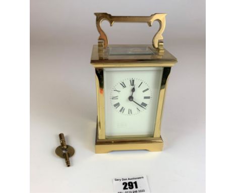 Brass carriage clock, 4.5” high plus handle. Has key but not working