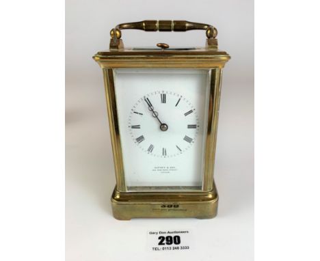 Brass carriage clock by Asprey &amp; Sons, London. 5” high plus handle. Working with key.