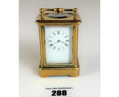 Miniature brass carriage clock, 3” high plus handle. Working with key