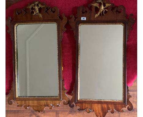 Pair of Chippendale style mahogany rectangular mirrors with gilt painted slip, fret carved frame and gilt ho-ho bird detail, 