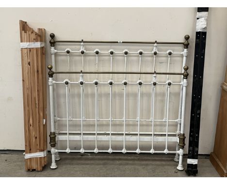A Victorian 4'6" iron and brass bedstead