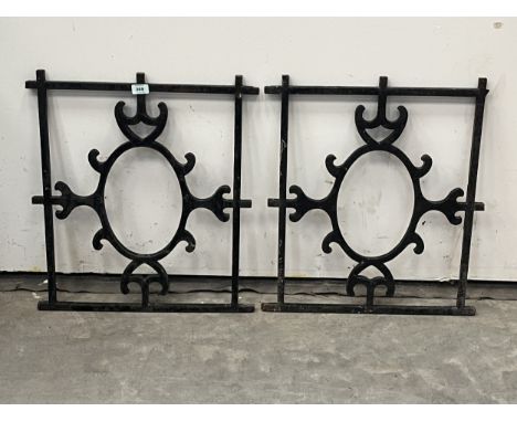 A pair of cast iron railing sections. 21" x 23½"