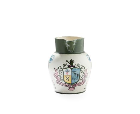 AN UNUSUAL WEMYSS WARE JUG EARLY 20TH CENTURY decorated by Edwin Sandland and painted with a central armorial motif of flower