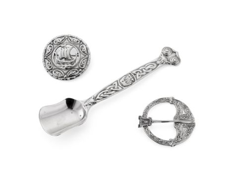 IONA - A SUGAR SPOON ALEXANDER RITCHIE marked IONA, AR/ Glasgow 1930; embossed Celtic motifs to stem; together with a penannu
