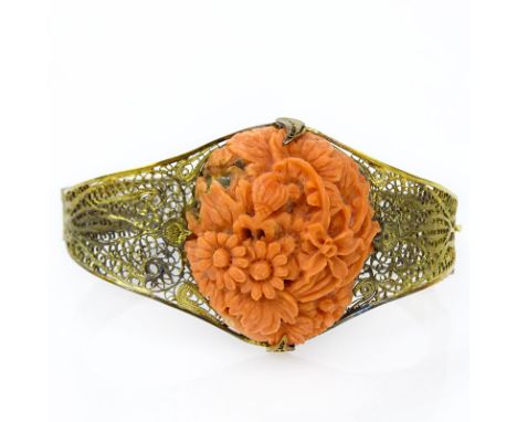 Antique Carved Red Coral and Silver Filigree Bangle Bracelet. Unsigned. Oxidation to silver, bracelet slightly out of round. 