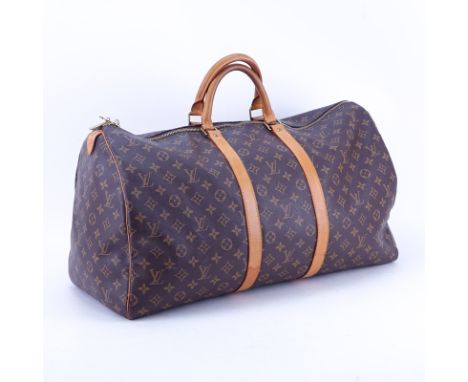 Louis Vuitton Monogram Keepall Duffel Bag With Luggage Tag. Canvas interior. No shoulder strap. Gently used condition with to