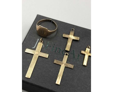 Two 9ct hallmarked gold crosses two other gold examples with no assay marks, and an engraved signet ring. Gross weight 7.12 g