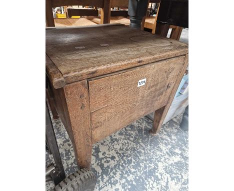 A Georgian oak commode.