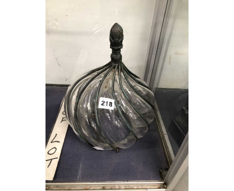 A wire and clear glass spirally wrythen ceiling light shade