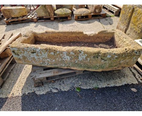 A large 19th-century carved stone shallow trough. H 26 W 143 D 67cms