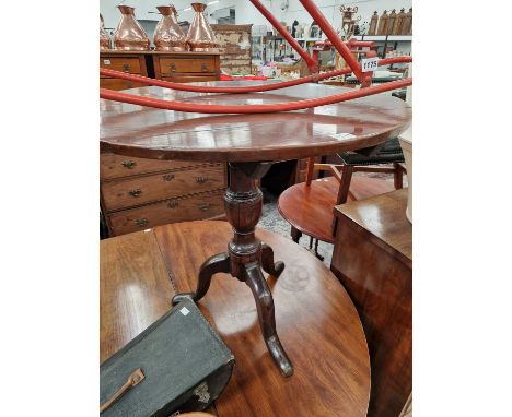 A Georgian yew wood Tilt top tripod table.