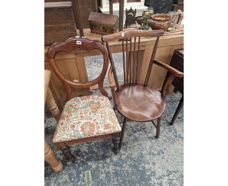 A Victorian side chair and a stick back arm chair.