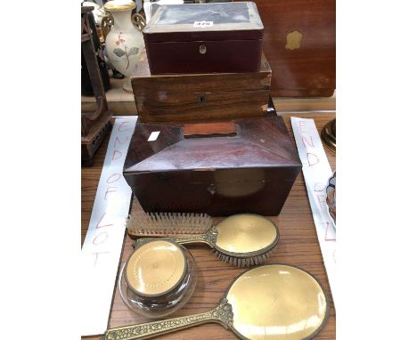 Three various wooden boxes, a sarcophagus tea caddy and a honey coloured enamelled part dressing table set
