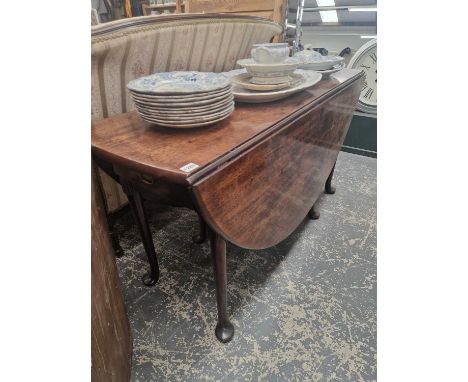 A Georgian pad foot gate leg dining table. H 72 D 136 W 150cms open
