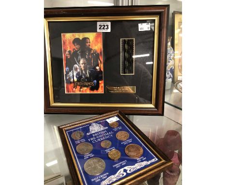 A Lord of the Rings Two Towers limited edition film cell together with a frame of 1967 pre-decimal coins