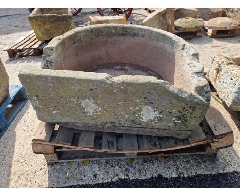 A large 19th-century d-form carved stone garden cistern /trough.