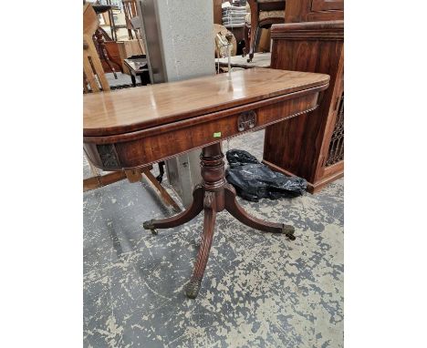 A regency mahogany fold over card table.
