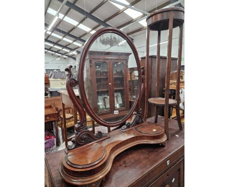 A victorian swing mirror with a trinket box base and a plant stand. 