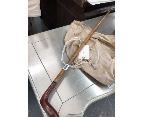A vintage sunday stick golfclub.