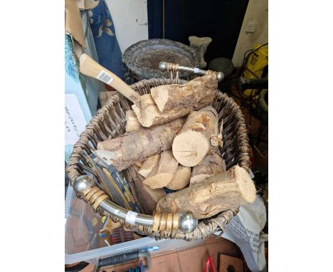 A log basket, logs and small axe.