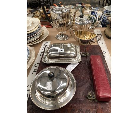 A cased Chinese jade archaic style knife, an electroplate three piece tea set, two covered dishes and a leather cased album o