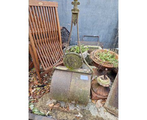 An antique cast iron garden roller