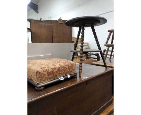 A mahogany two tier table on three bobbin turned legs together with a footstool
