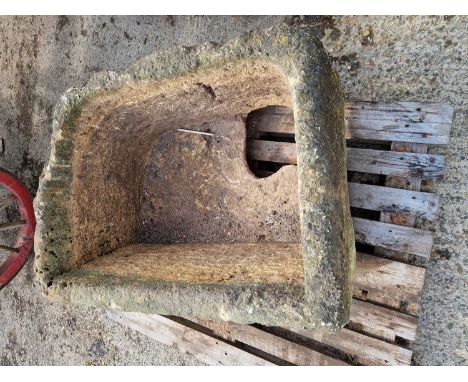 A large 19th-century carved stone cistern trough.