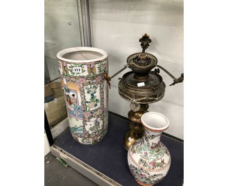 A contemporary Canton stick stand and a vase together with a brass oil lamp