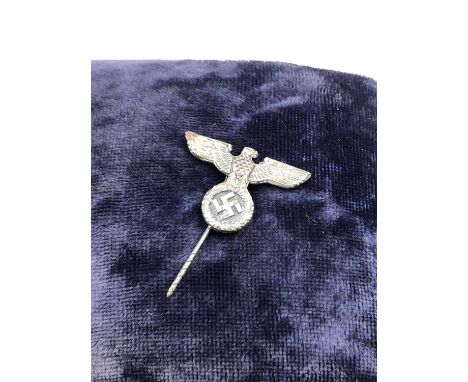 A vintage WW2 German SS M1/129 stick pin badge contained in a lined hallmarked silver and blue velvet small jewellery case, e