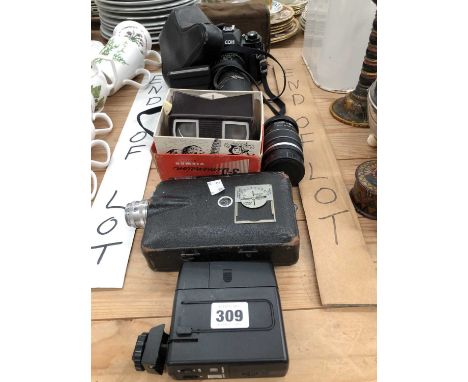 A Ricoh camera, lenses and flash unit, a Kodak cine camera, a View-master with some circular slides, etc.