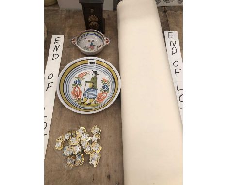 A Quimper plate and bowl, four maps of the Welsh borders, military cap badges together with a wooden money box bearing a gren