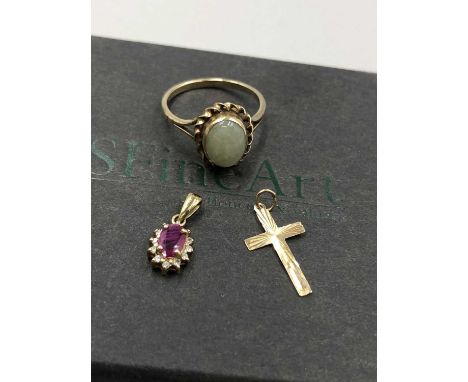 A 9ct hallmarked stone set cabochon ring in a rub-over setting. Finger size M, together with a small gold cross and a 9ct hal