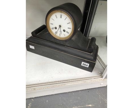 A black slate cased mantel clock with a strike mechanism