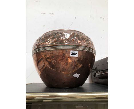 A copper planter bowl