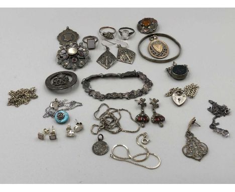 A collection of silver jewellery, including a stone set spinning fob, gem-set brooches, presentation medallion, a 9ct &amp; s