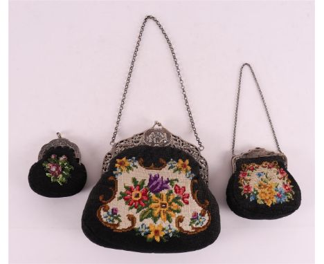 A 2nd grade 835/1000 silver ajour bag bracket on fabric bag, maker's mark: Bouwman, T. &amp; Meulen, J. &amp; S. v/d, Joure(1